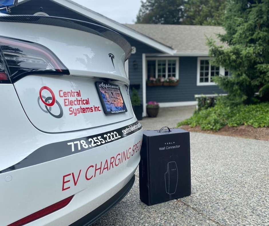 central electrical systems branded testa besides a box of a new tesla charger box