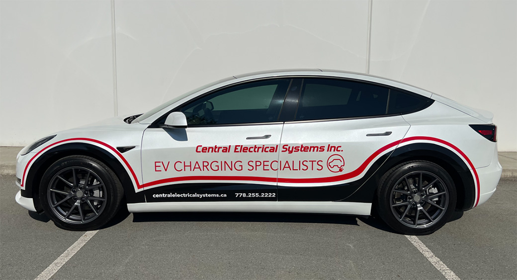 tesla with ev charging specialist text from central electrical systems